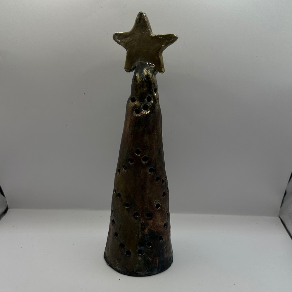 Handmade ceramic tree figurine for use with candle inside base